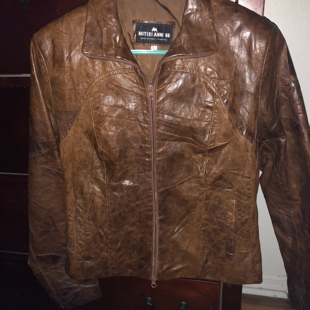 Brown leather jacket size small.